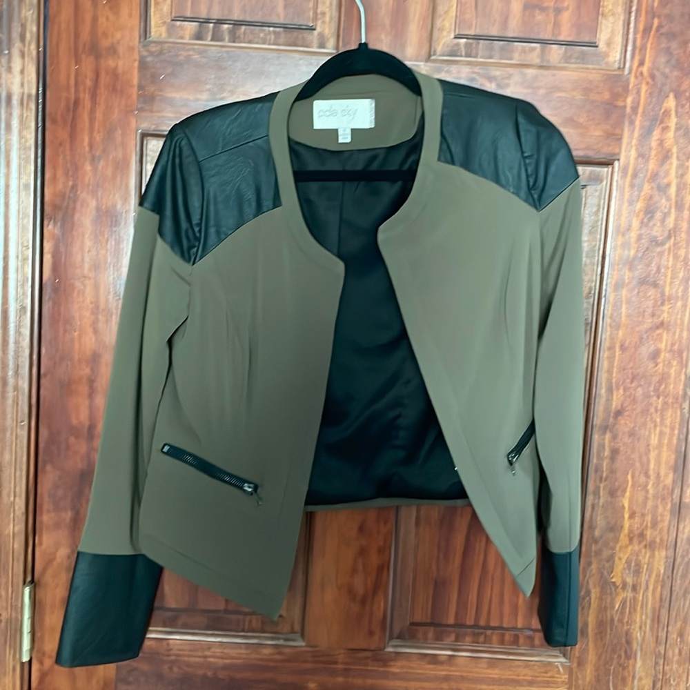 Green and faux leather jacket
